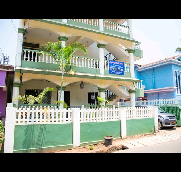 Twilight Guest House exterior with lush green surroundings